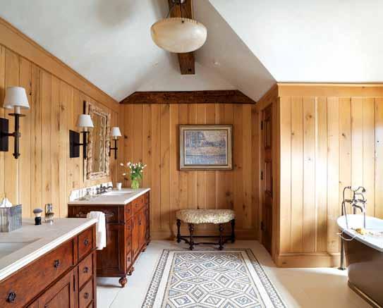 Opposite, top: In the gracious master bath, limestone floors and countertops and white oak walls brighten the space.