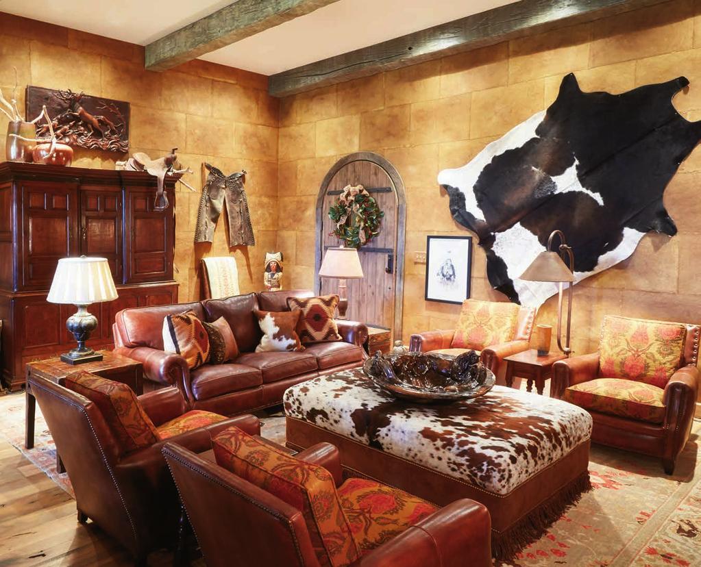 ing wall displays a large horsehide rug. Native American statuary occupies many of the horizontal surfaces while Westernthemed artwork is scattered on the walls. And oh, those walls!