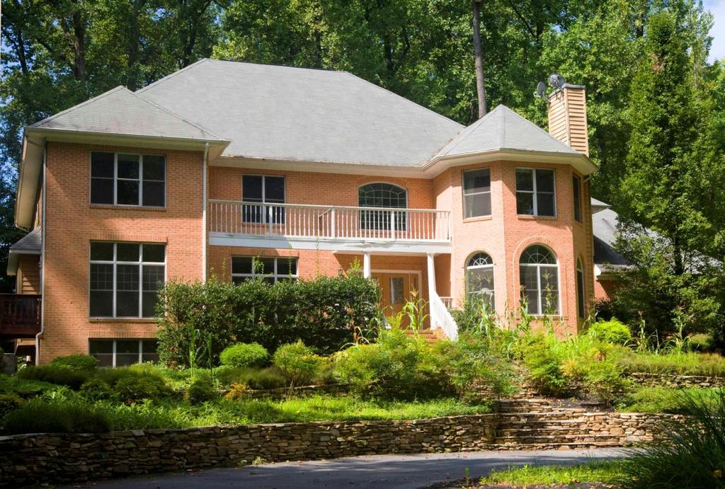 CHAPEL WOODS This owner was enamored with this beautifully wooded lot when he engaged our