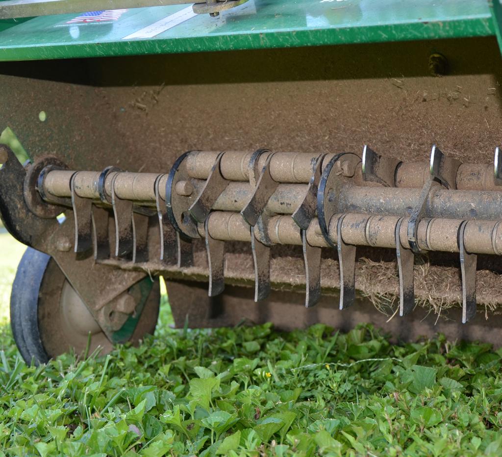 Figure 3. The underside of a dethatching machine showing the sling blades that remove thatch and create small furrows in the soil. Figure 4.