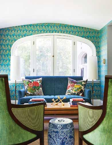 A beautiful Cole and Son wall covering with that same motif was used on the walls in the foyer. The hide rug in the foyer also has a subtle peacock motif that is a fun nod to the home s history.