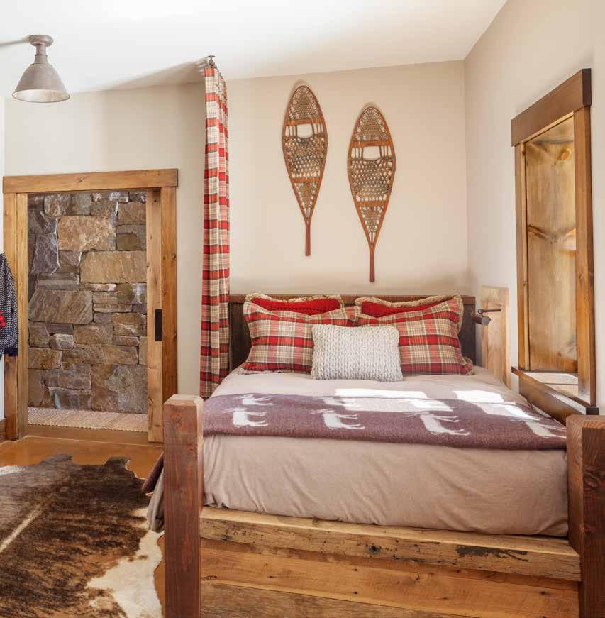 The bunkroom (below) can sleep an entire family. Here, Bruce Lilly of Clearwater Builders in Bethel built a bed with storage below. The plaid curtain closes off the bed from the rest of the room.