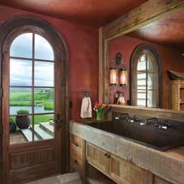 A sitting area was specifically designed to incorporate Russell s antique tem, and when you add gun collection. The master bath leads to a hot tub overlooking the water and mountain views.