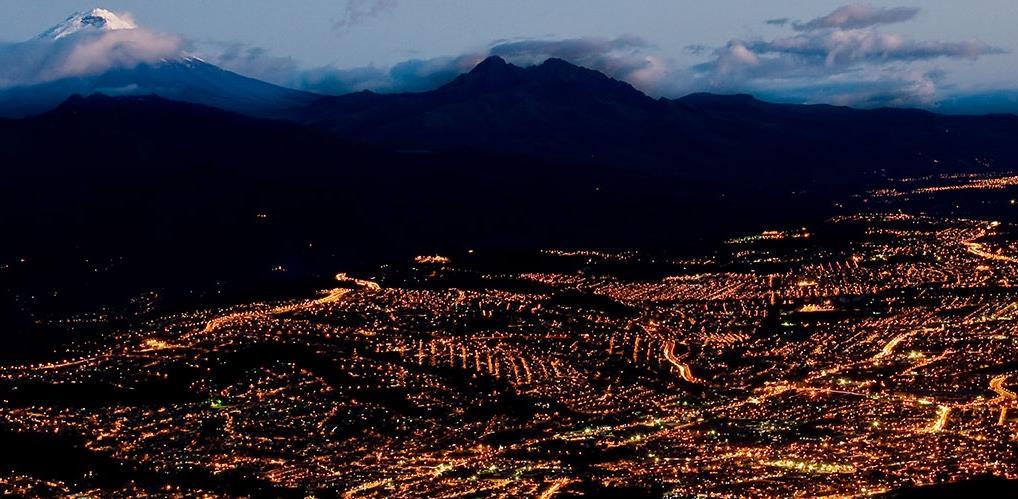Quito at night with Cotopaxi mountain Santiago Cornejo HABITAT III in Quito on Housing and Sustainable Urban Development #NewUrbanAgenda;