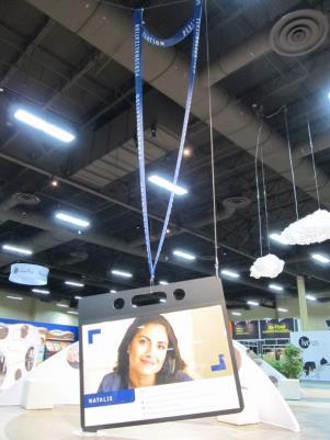 The International Surface Event 2014 (Continued) Name Tag = Personalization Hanging from the ceiling, an enormous lanyard with a name tag attached profiling Natalie, a busy mom who is shopping for
