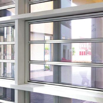 Em-Louvre electrically operated smoke vents open to 90 in under 60 seconds, to release smoke and heat from stairwells, corridors, lobbies and atria, and ensure escape routes are kept clear.
