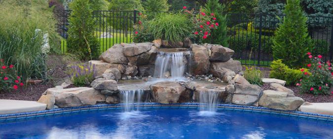 5 High x 10 Wide two-tiered natural stone waterfall that cascades into your pool, with 