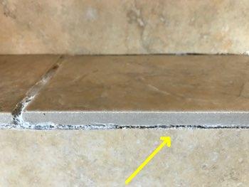 Voids in the grout between some of