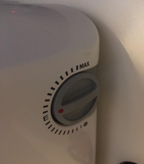 Controlling the Heating The heating can be controlled in one of 3 ways: 1- To switch the heating on or off please use the button located beside heater on the wall as shown with the
