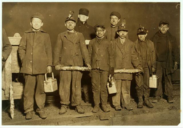 At the close of the day. Just up from the shaft. All work below ground in apennsylvania Coal Mine. Smallest boy, next to right hand end is a nipper.
