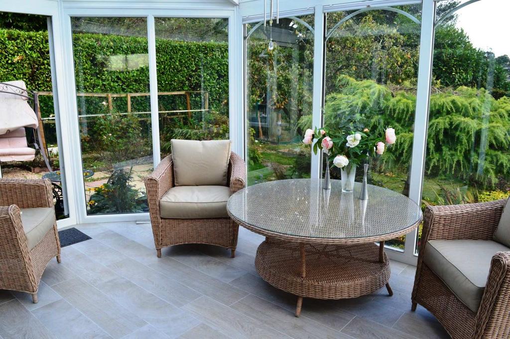 The conservatory has a ceramic tiled floor, full height double glazed UPVC windows, glazed roof, and a pair of double glazed French doors leads out to the rear garden.