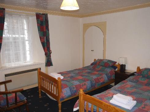 Room 4 - Double: Carpet, 2 windows, panel heater, door to ensuite.