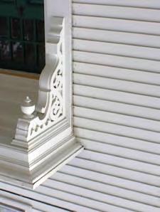 Left: This porch has several key Italianate elements, including paired brackets, double