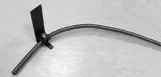 4. Add a gradual 30 degree bend approximately 4" from the drum end of the cable as shown in Figure 20. Figure 20 Torque Arm Attached to Cable.