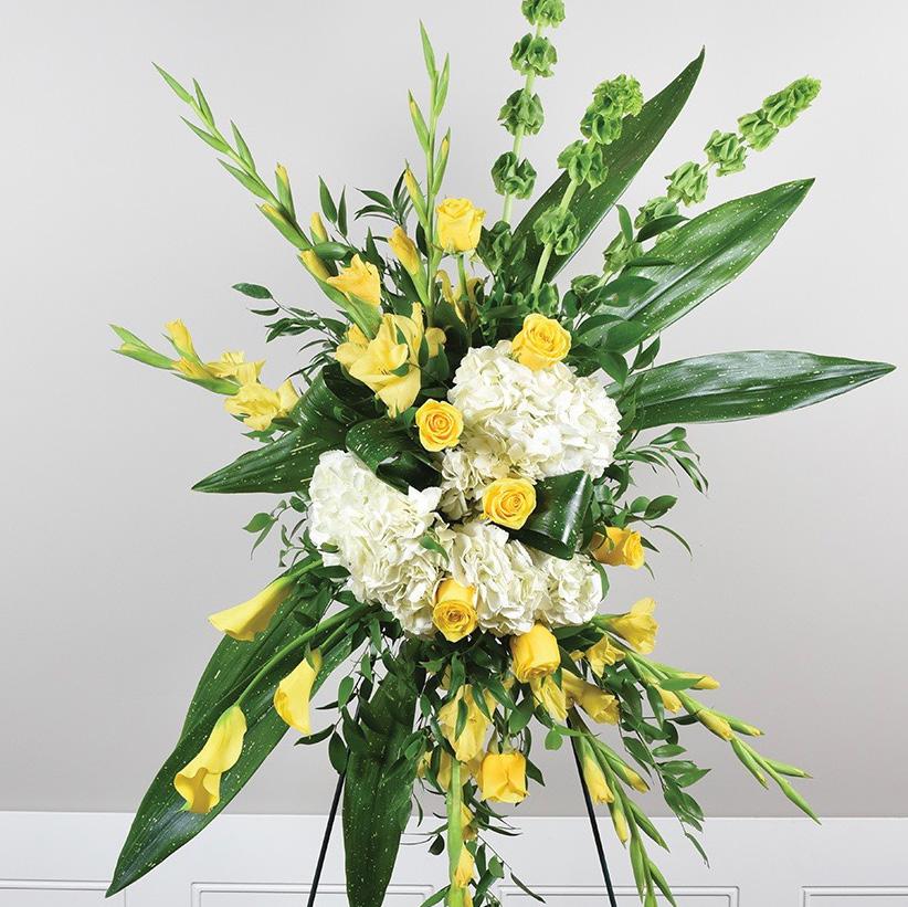 yellow calla lilies 8 stems yellow roses 12 stems leather leaf 9 stems emerald 8 stems emerald 12 stems