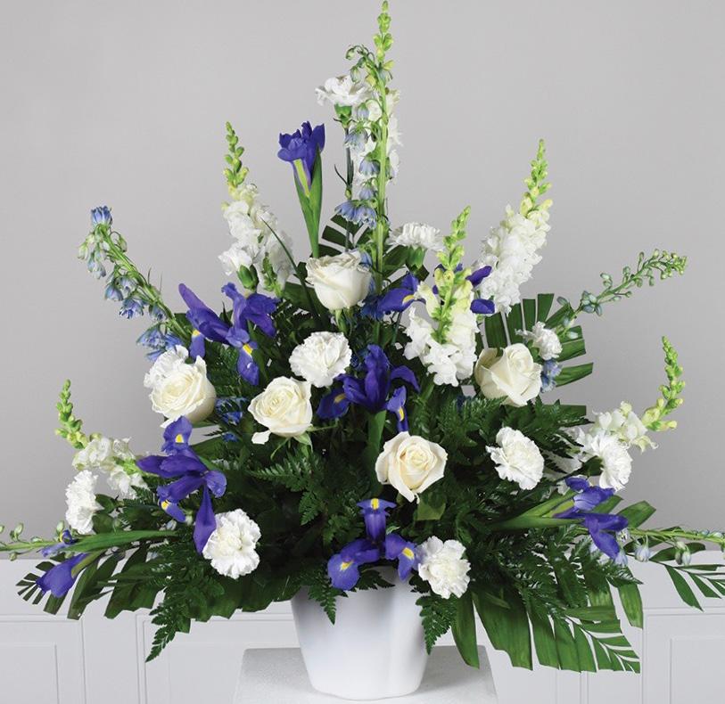 lilies 8 stems purple iris 5 stems white roses 5 stems light blue candlestick delphinium