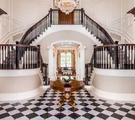Intricate, proportionate architectural moldings enhanced by the Renaissance-inspired, Ionic variation, Scamozzi column capitals adorn the interior and are especially evident in the formal living,