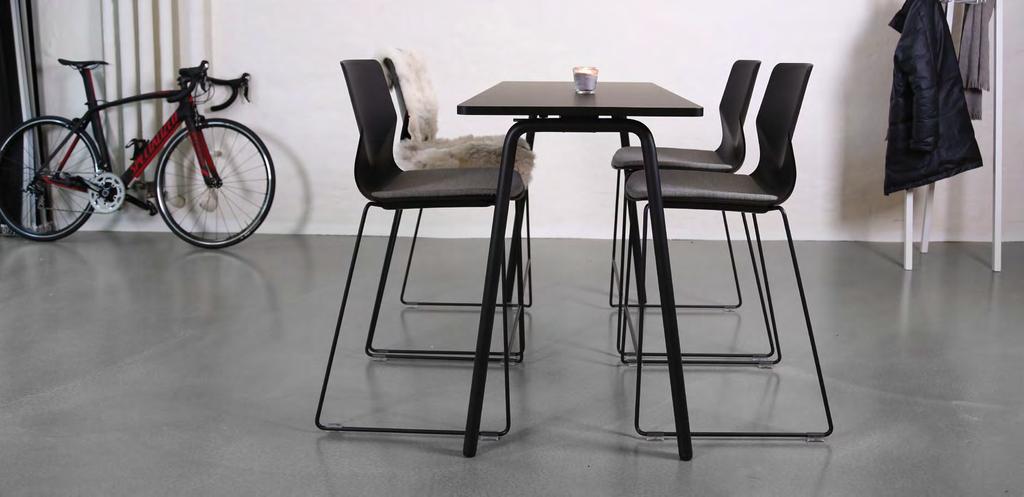 FourSure 90 in black with matching powder coated frames and upholstered seat pads, shown with a FourReal table.