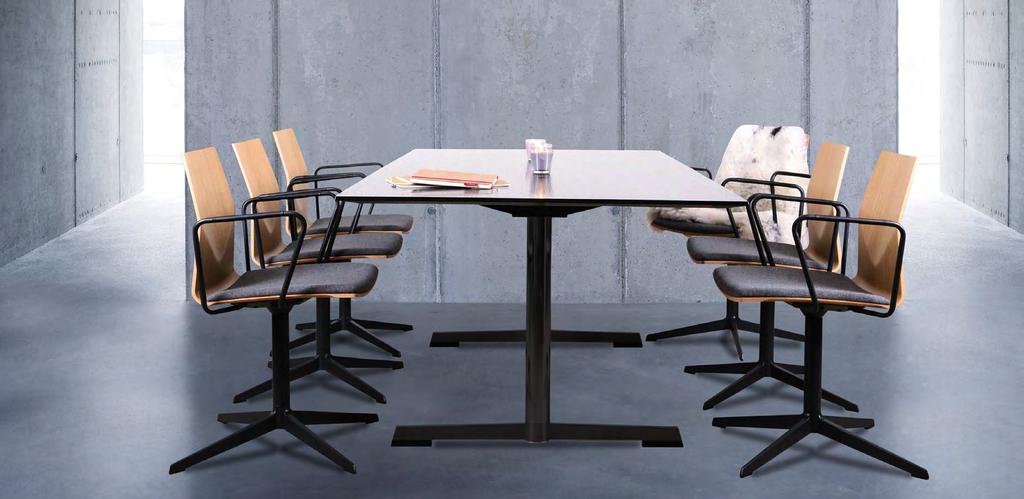 Wood veneer FourCast Evo chairs with seat pads, arms and black powder coated frame, with a FourMat table.