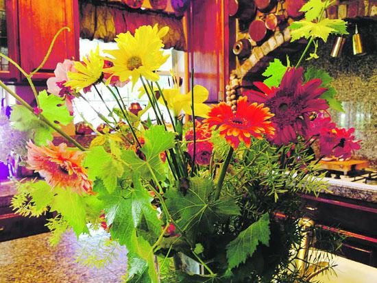 Published August 27th, 2014 's Gardening Guide for September By Fill a vase with orange and yellow gerbera, grape leaves, and asparagus ferns to brighten your autumn kitchen.