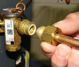 Remove the valve identification sticker from the valve and place it adjacent to the Aspen model number on unit name plate. III-12a.