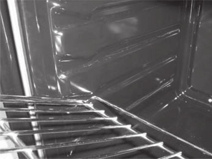 Do not use harsh abrasive cleaners or sharp metal scrapers to clean the oven door glass since they can scratch the surface, which may result in shattering of the glass.