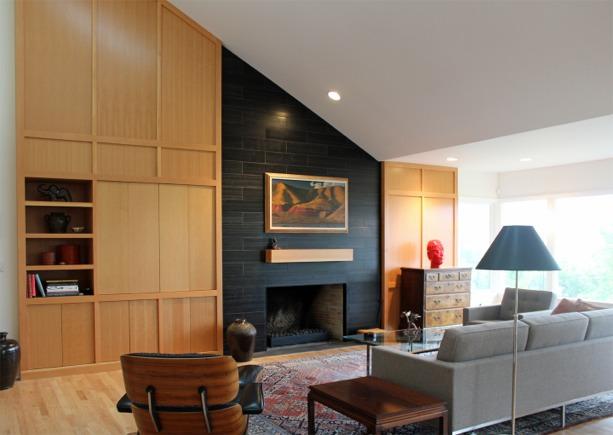 The existing fireplace was plain and ordinary. Now that the space was vaulted, the fireplace needed to be more dramatic in order to remain the focal point of the living area.