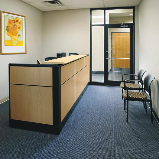Private offices feature WorkZone desking and Impress task chairs. The reception area includes the WireWorks panel system.