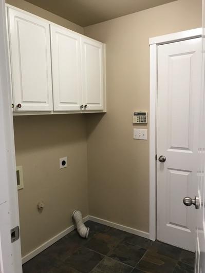 1. Location 1st Floor Laundry 2. Condition Ceiling and walls are in good condition overall.