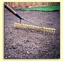 Gently tread or roll the surface by foot to reveal any soft patches which will dip, then rake soil into the soft dipped areas so the area is