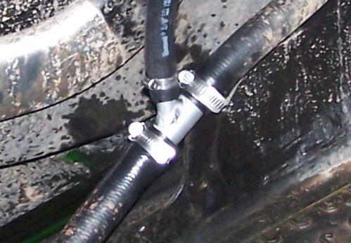 7) Using 1 hole saw, cut holes into panel as shown below: ½ 10 8 1/2 9 8) From inside of vehicle, pinch coolant hose as shown and cut through hose as neatly as