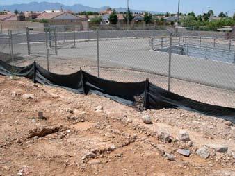 Using Silt Fence and Fiber Rolls it will not wash into storm drains, ditches, channels, or streams. Re-trench and re-install fencing and fiber rolls that are undercut by rills or gullies.
