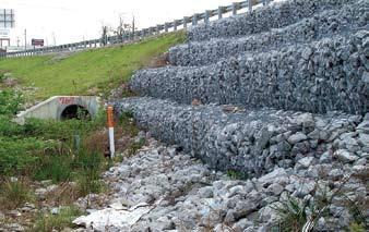 Good use of rock-filled stacked gabion baskets to protect steep slope.