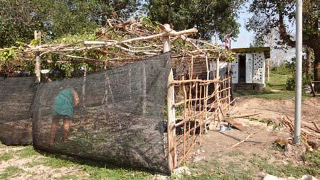 A more Basic structure, but just as effective in covering the plants. This can be done with found materials. While it will require a more solid structure, the costs can be minimal.