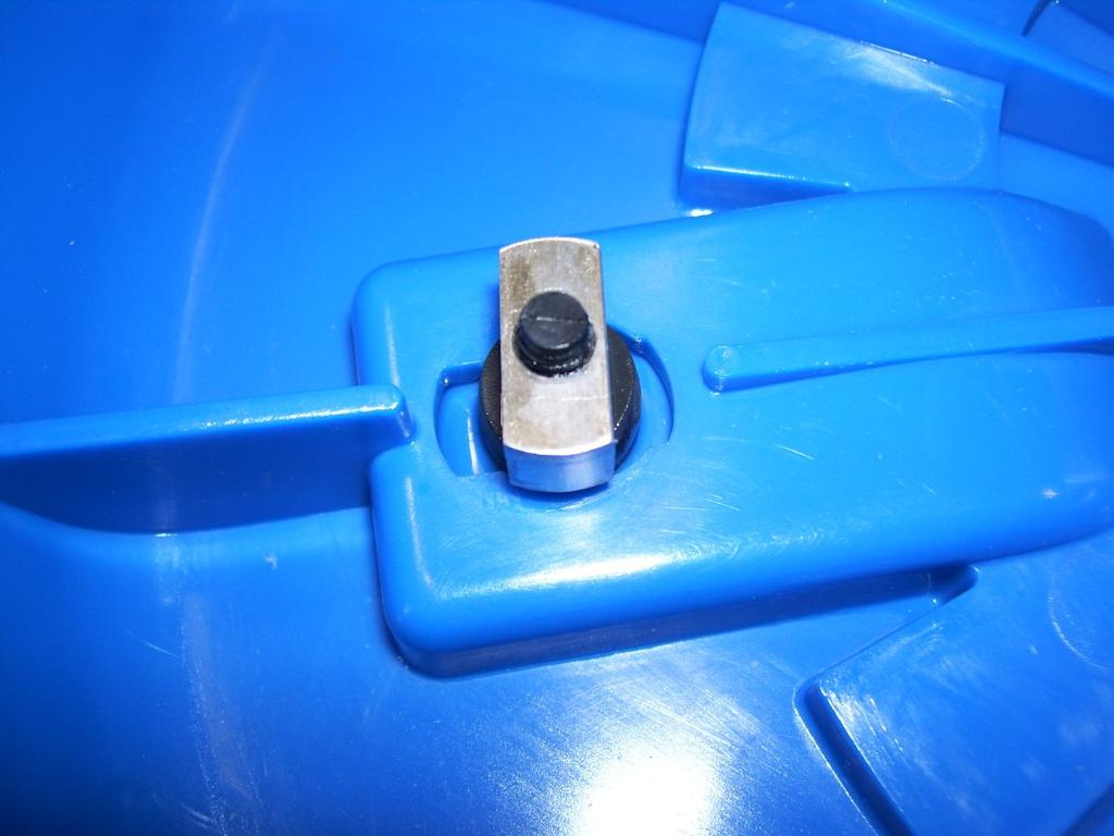8. Turn the rectangular retaining nuts perpendicular to the slots in the bottom of the Inner