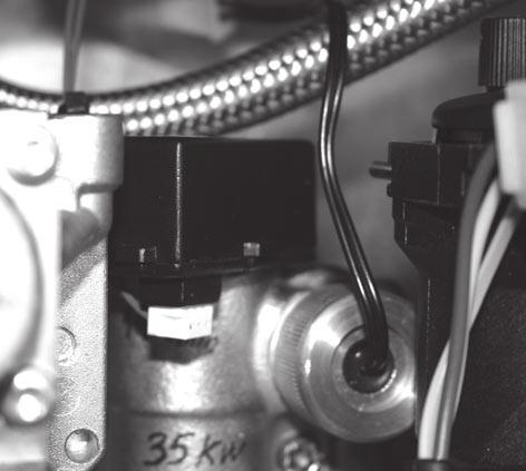 74 DHW FLOW SWITCH REPLACEMENT SERVICING 1. Refer to frame 52. 2. Swing the control box down into the servicing position. Refer to Frame 46. 3. Unplug the electrical connection. 4. Carefully pull the switch upwards to disengage.