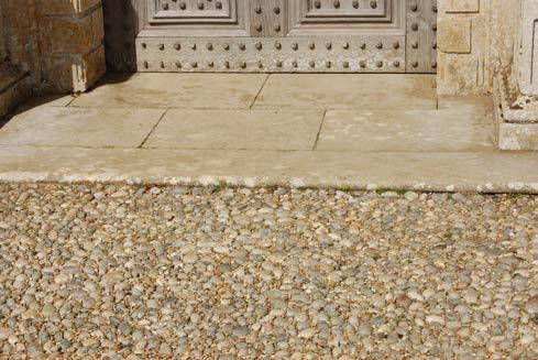 There is a single step approx. 35mm high from the outside gravelled area into the House. A small area of cobbles is just before this step, the cobble area is approximately 1270mm wide.