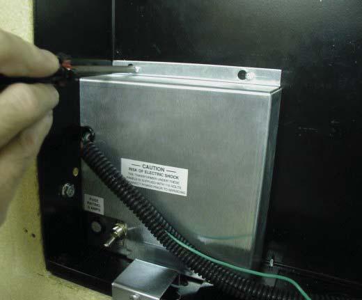 Make conduit connections for wiring from the facility emergency power source.