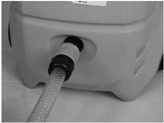 Once the detergent has been applied, spray the detergent off of the work area by using the adjustable nozzle.