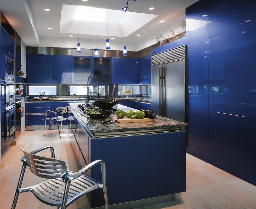 Kitchen after The most dramatic change was in the kitchen, where e bright blue, high-gloss metallic lacquered