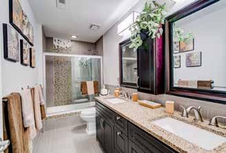 w/heated seat Knee-wall at tub w/ceiling height custom Lucite display shelving Double window & additional window w/window treatments Crown molding Recessed lighting Crystal pendant light Custom