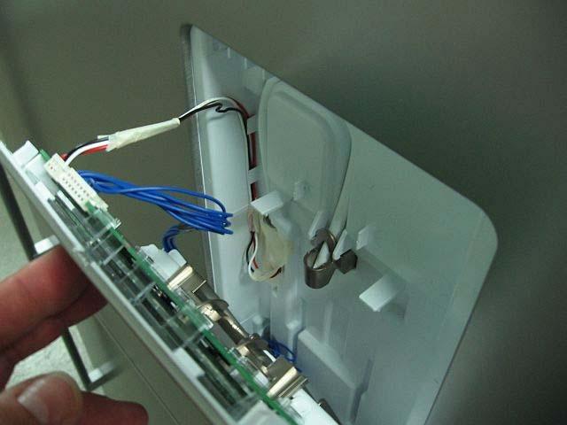 Step 4 Refit in reverse order. Ensure the wiring is placed and clipped into the correct position.