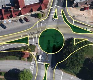 Option 2: A dualcircle option that could fit within the existing intersection footprint. This would allow freeflow movement and replace both North and South Clarendon signals.