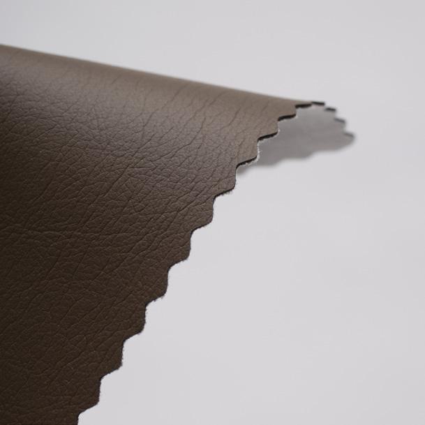 It is composed of a 100% PU surface with 65% PET, 35% rayon backing simulating the look and feel of leather.