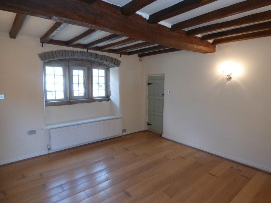 Door concealing cellar entrance (not for use), inset entrance mat, telephone point and doors off to: SITTING ROOM 2 / DINING ROOM (14'9 x 12 9 ), with solid oak flooring, oak beams to ceiling and