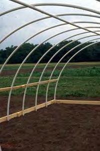 Greenhouse Construction: Install Overhead Hoop Support 1. Attach support on inside of hoops 2.