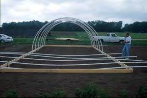 Greenhouse Construction: Setting the Hoops 1. Secure hoops to base with bolts and screws 2.