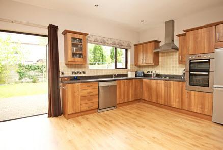 Integrated appliances including stainless steel double oven, 4 ring gas hob, plumbed for