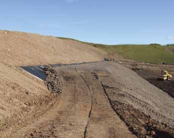 The poor friction interface between the soil and the geomembrane can lead to instability and possible erosion occurrences in the soil layer.