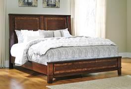 solids with sophisticated Mapa burl veneer inlay accents Traditionally inspired cherry color provides for an antique feel Sturdy panel bed design with low platform-look footboard Round metal drawer